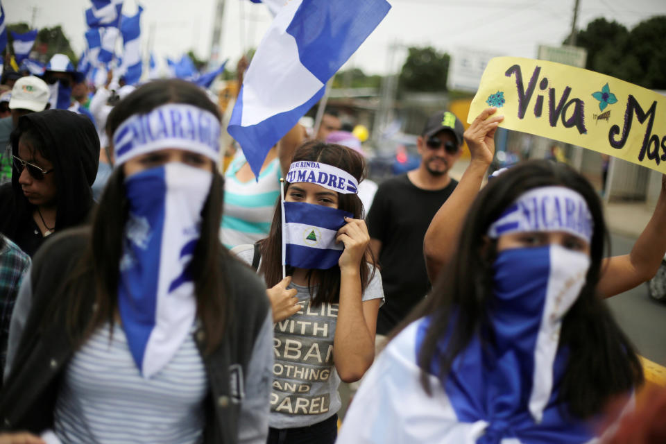 Demonstrators take part in a march to demand the ouster of Ortega in Managua on July 22. (Photo: Jorge Cabrera / Reuters)