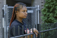 In this Sept. 26, 2021, photo Savannah, 17, poses for a portrait in Chicago. She was 14, when on two occasions just 11 weeks apart, police kicked open the front door of her home on Chicago's South Side and ordered Savannah and her siblings to get down on the floor. (AP Photo/Teresa Crawford)