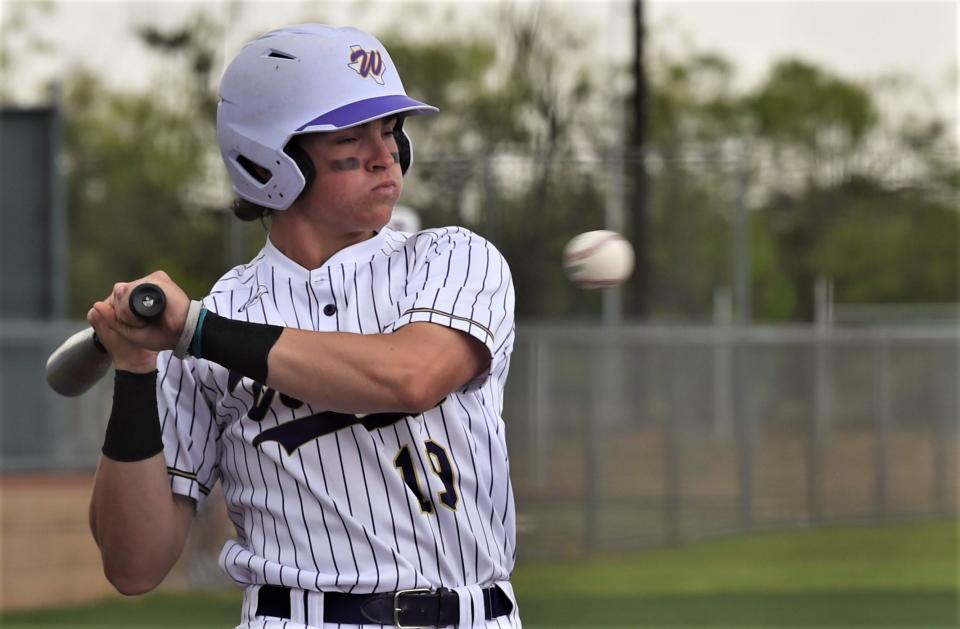 Wylie's Sam Walker dodges an inside pitch in the fourth inning against Lubbock High.