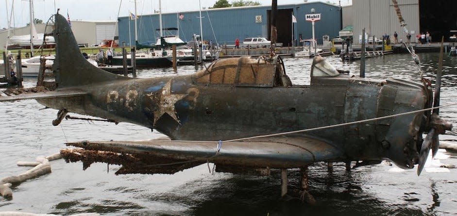 John Lendo's U.S. Navy Douglas SBD-2P Dauntless Dive Bomber which crashed in a 1944 Great Lakes training mission and was recovered from Lake Michigan in 2018. (Google Photo)