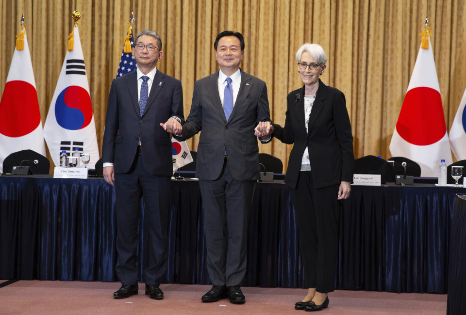 Japanese Vice Mminister for Foreign Affairs Takeo Mori, South Korea's First Vice Foreign Minister Cho Hyun-dong and U.S. Deputy Secretary of State Wendy Sherman pose for a photo prior to their meeting at the Foreign Ministry in Seoul, South Korea, June 8 2022. (Jeon Heon-Kyun/Pool Photo via AP)