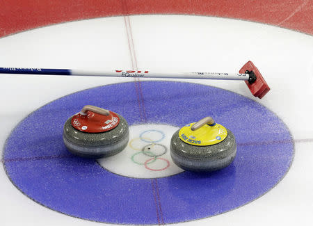 FILE PHOTO: Stones are seen on a sheet during the men's curling round robin games in the Ice Cube Curling Centre at the Sochi 2014 Winter Olympic Games February 16, 2014. REUTERS/Ints Kalnins/File photo