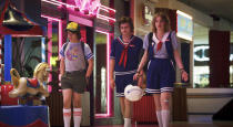 This image released by Netflix shows, from left, Gaten Matarazzo, Joe Keery, and Maya Hawke in a scene from "Stranger Things." The scene was shot on location at the Gwinnett Place Mall in Duluth, Ga. (Netflix via AP)