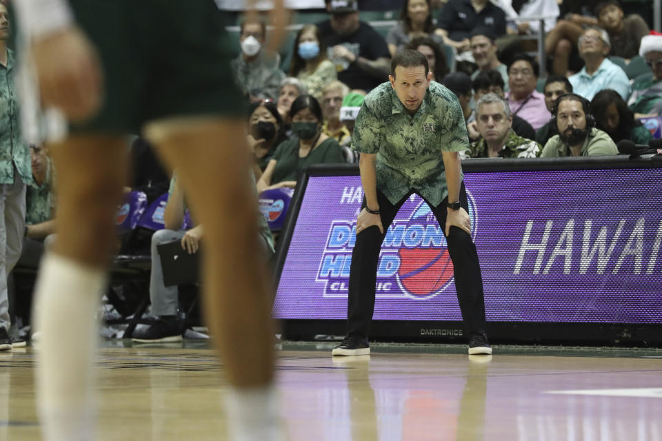 Hawaii head coach Eran Ganot watches the action from the sideline during the first half of an NCAA college basketball game against SMU, Sunday, Dec. 25, 2022, in Honolulu. (AP Photo/Marco Garcia)