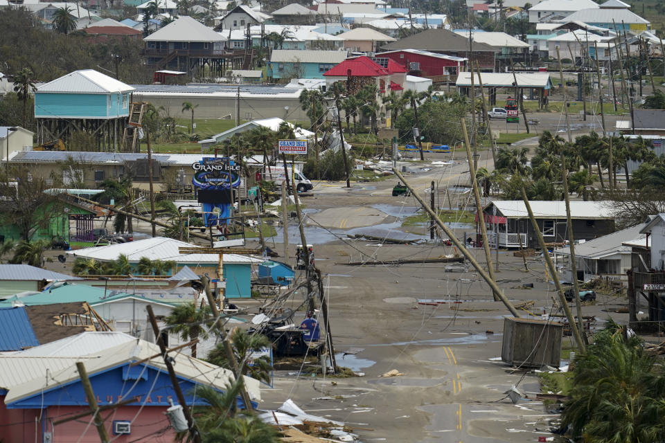 The remains of destroyed homes and businesses are seen in the aftermath of Hurricane Ida in Grand Isle, La., Tuesday, Aug. 31, 2021. (AP Photo/Gerald Herbert)