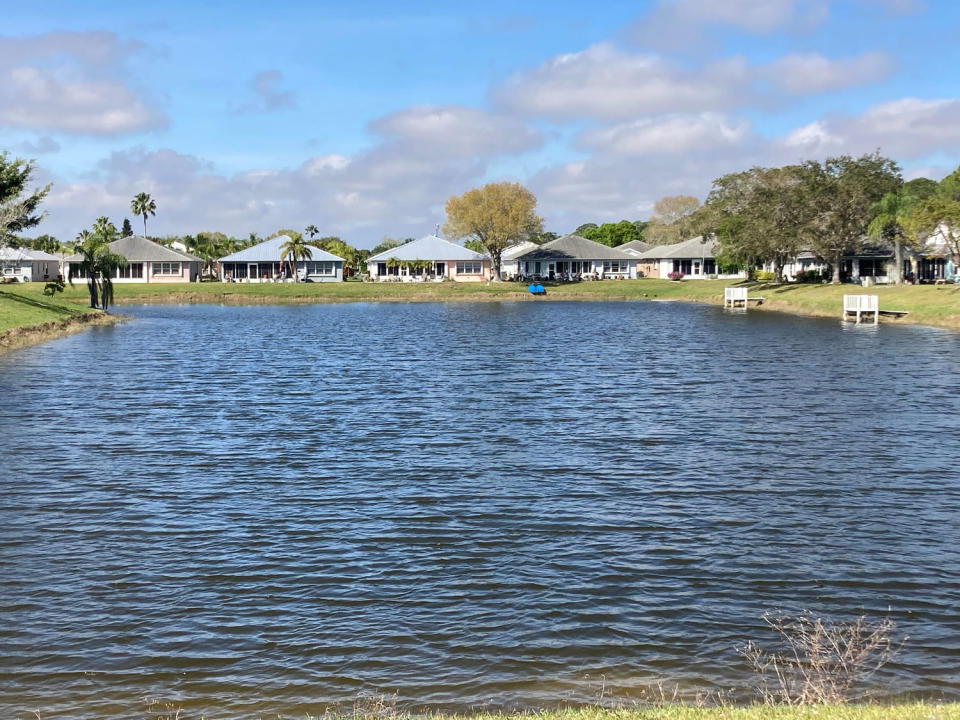 The lake in the Spanish Lakes Fairways community where Gloria Serge, 85, died after an encounter with an alligator. (Will Greenlee / USA Today Network)