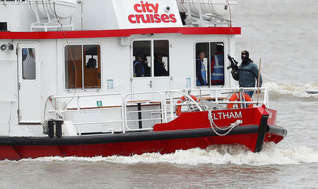 An actor playing an armed terrorist takes part in a training exercise by counter terrorism officers of the Metropolitan Police in a scenario to rescue hostages from a cruise boat on the river Thames, in London, Britain March 19, 2017. REUTERS/Peter Nicholls