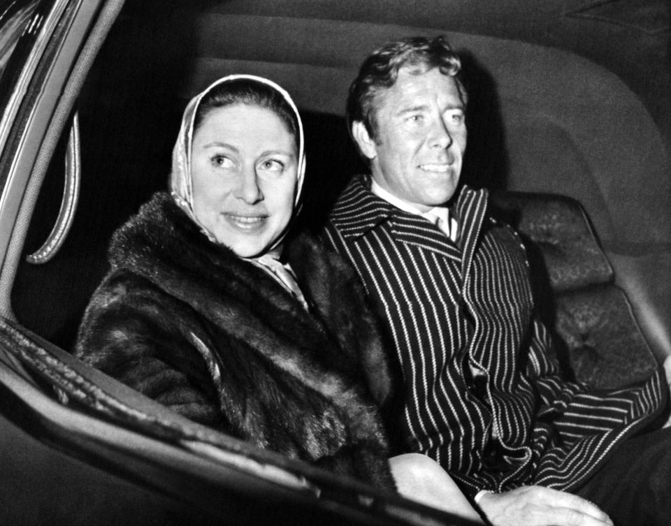 Britain's Princess Margaret and her husband, Lord Snowdon, smiles from inside a car after they arrived at New York's Kennedy airport on, March 14, 1968. The royal couple will attend a fund-raising party for the New York Association for Brain-Injured Children. (AP Photo)