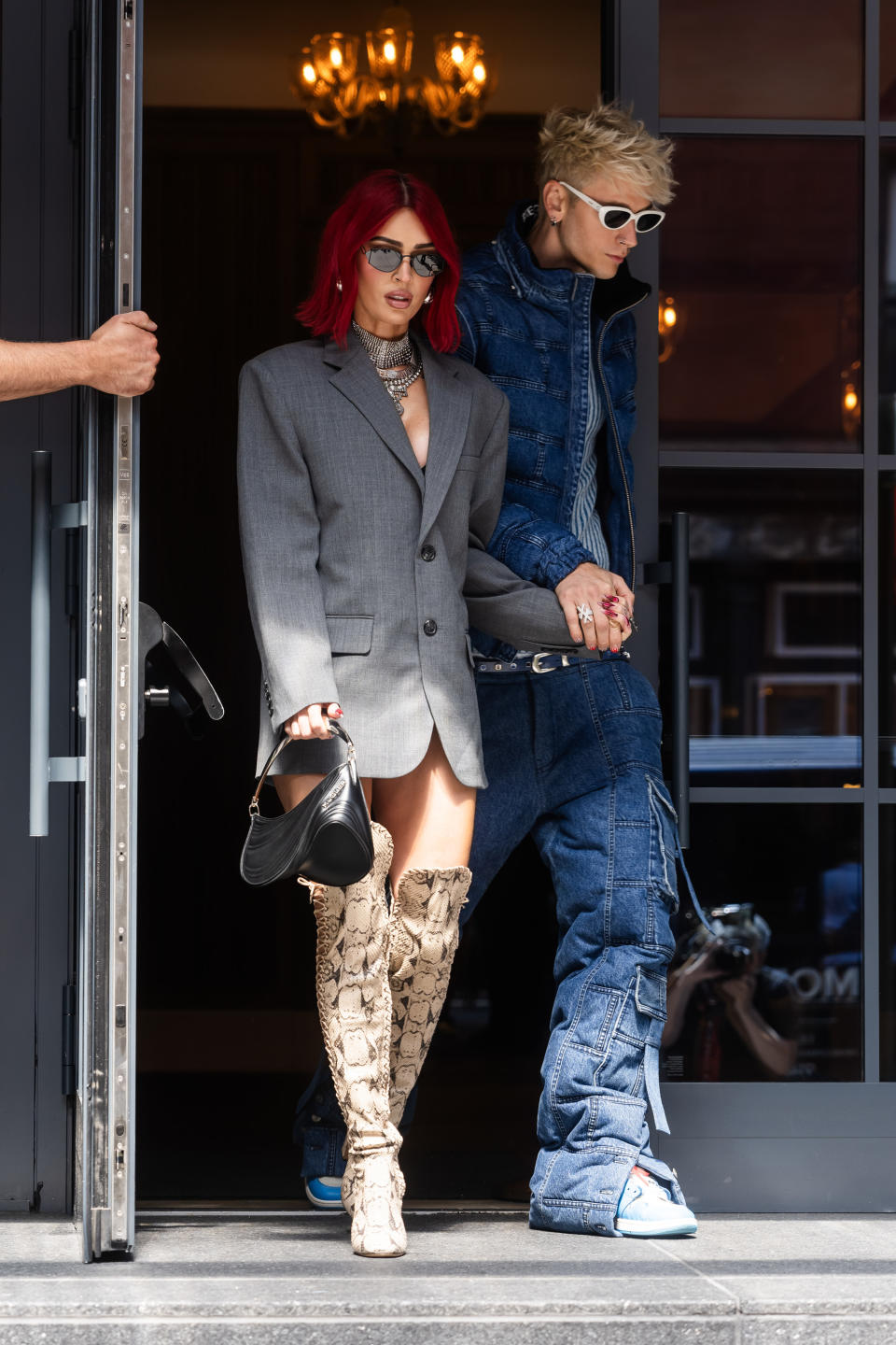 Megan Fox and MGK leave a building