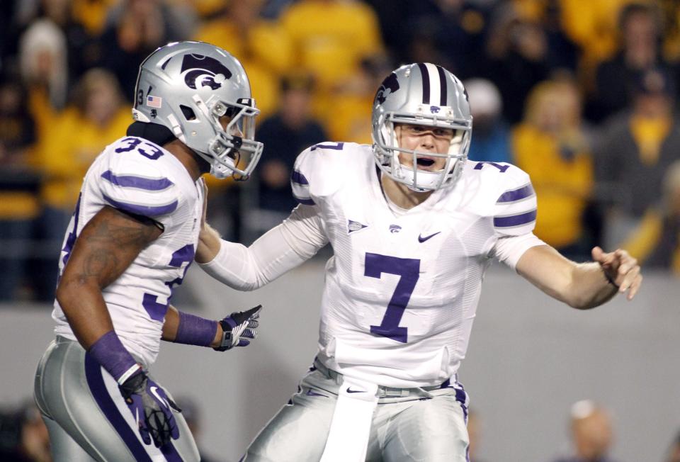 Collin Klein #7 of the Kansas State Wildcats directs the offense against the West Virginia Mountaineers during the game on October 20, 2012 at Mountaineer Field in Morgantown, West Virginia. (Photo by Justin K. Aller/Getty Images)