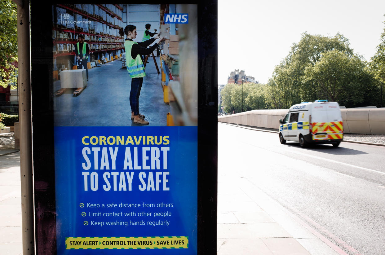 A police van drives past government messaging to 'Stay Alert', the core slogan of its new covid-19 prevention campaign, at a bus stop at Hyde Park Corner in London, England, on May 15, 2020. Nearly eight full weeks have now passed since British Prime Minister Boris Johnson ordered the country's coronavirus lockdown on March 23, although across England some of the measures, including the restriction on exercising outdoors more than once a day, have this week been removed. (Photo by David Cliff/NurPhoto via Getty Images)