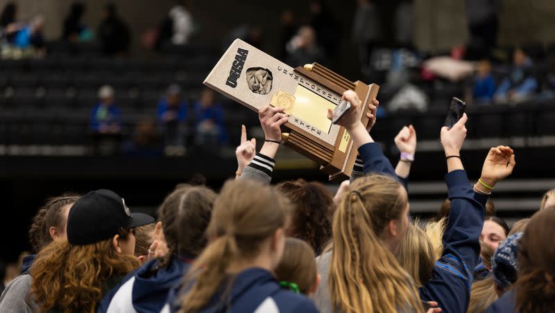 Copper Hills High School celebrates a win during the 6A Girls Wrestling State Championships at the UCCU Center in Orem on Thursday, Feb. 15, 2024.