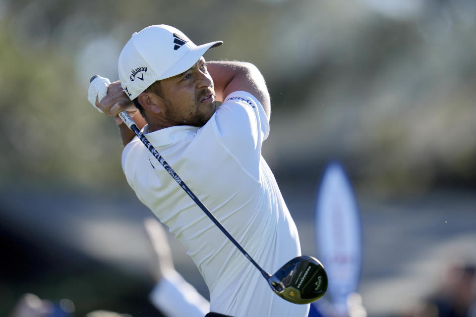 Xander Schauffele watches his tee shot on the 10th hole of the North Course at Torrey Pines during the first round of the Farmers Insurance Open golf tournament, Wednesday, Jan. 25, 2023, in San Diego. (AP Photo/Gregory Bull)