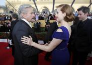 Actress Amy Adams, from the film "American Hustle," greets actor Michael Douglas, from "Behind the Candelabra," as they arrive at the 20th annual Screen Actors Guild Awards in Los Angeles, California January 18, 2014. REUTERS/Mario Anzuoni (UNITED STATES - Tags: ENTERTAINMENT) (SAGAWARDS-ARRIVALS)