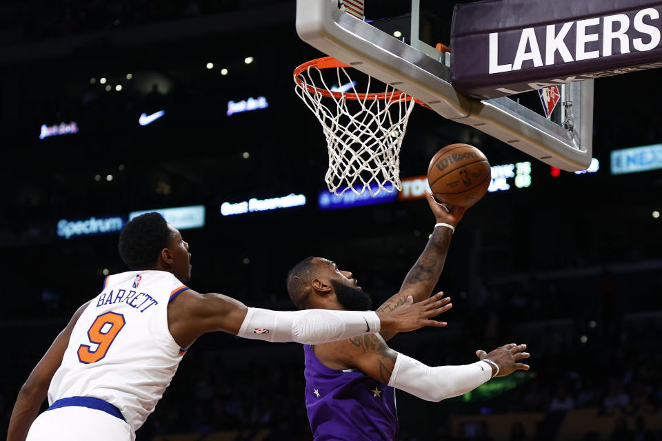 LOS ANGELES, CALIFORNIA - FEBRUARY 05:  LeBron James #6 of the Los Angeles Lakers takes a shot against RJ Barrett #9 of the New York Knicks in the third quarter at Crypto.com Arena on February 05, 2022 in Los Angeles, California.  NOTE TO USER: User expressly acknowledges and agrees that, by downloading and/or using this Photograph, user is consenting to the terms and conditions of the Getty Images License Agreement.  (Photo by Ronald Martinez/Getty Images)