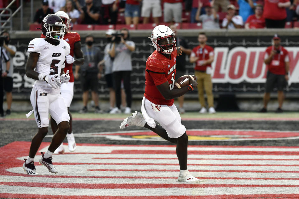 Louisville quarterback Malik Cunningham (3) runs for a touchdown during the first half of an NCAA college football game against Eastern Kentucky in Louisville, Ky., Saturday, Sept. 11, 2021. (AP Photo/Timothy D. Easley)