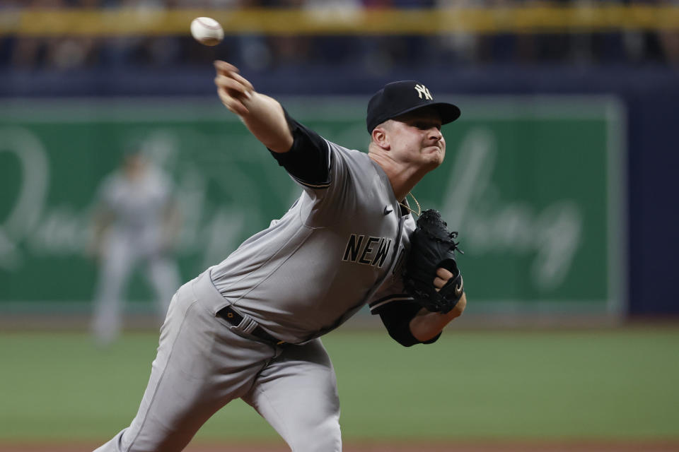 New York Yankees pitcher Clarke Schmidt throws to a Tampa Bay Rays batter during the first inning of a baseball game Saturday, Aug. 26, 2023, in St. Petersburg, Fla. (AP Photo/Scott Audette)