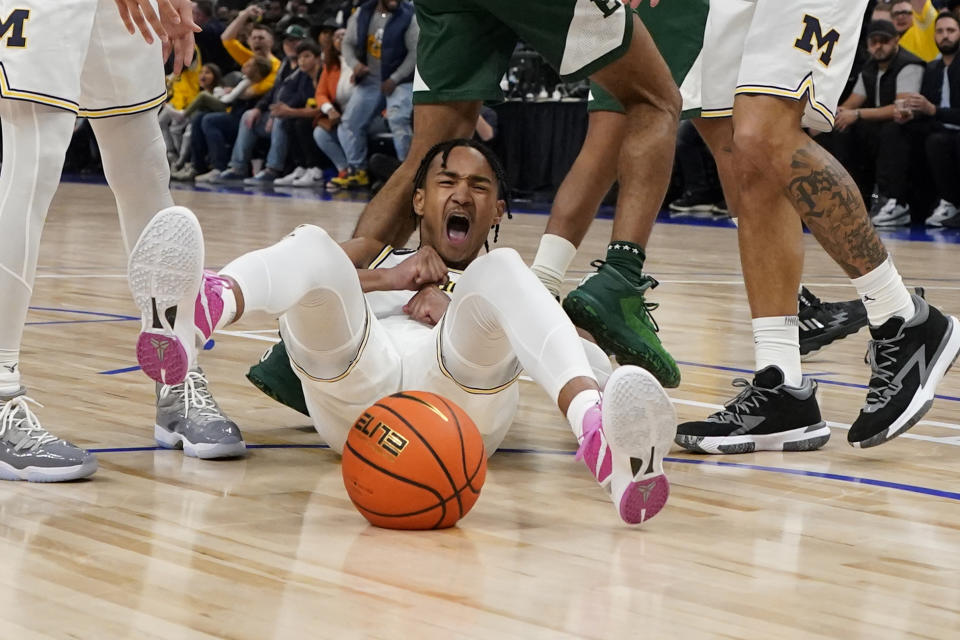 Michigan guard Kobe Bufkin reacts after making a basket during the second half of an NCAA college basketball game against Eastern Michigan, Friday, Nov. 11, 2022, in Detroit. (AP Photo/Carlos Osorio)