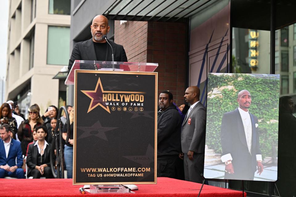 US director Allen Hughes speaks at the Hollywood Walk of Fame star ceremony of US rapper Tupac Shakur, in Hollywood, California, on June 7, 2023. Slain rap legend Tupac Shakur was honored with a star on Hollywood's Walk of Fame on Wednesday, almost three decades after the best-selling artist was gunned down in a drive-by shooting. The ceremony paid tribute to a rapper who died at age 25 after a brief but spectacular career, in which he went from backup dancer to self-styled gangsta and one of the most influential figures in hip-hop. (Photo by Robyn Beck / AFP) (Photo by ROBYN BECK/AFP via Getty Images)