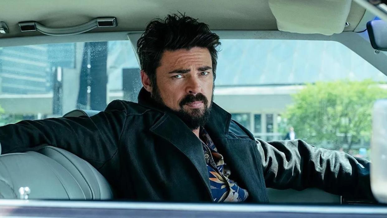  Karl Urban at the wheel of a car in The Boys. 