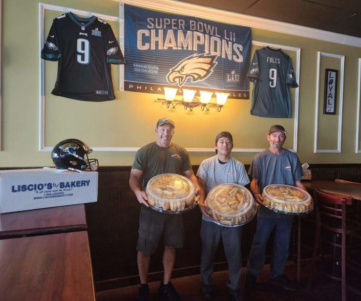 Philly's Finest owner Jeff Harris (left to right) and employees Gamseng Hkangma and Matt Mccrone pose Monday with the cheesesteaks to be delivered to Coach Doug Pederson and the Jacksonville Jaguars on behalf of the Philadelphia Eagles after Sunday's win against the Dallas Cowboys.
(Photo: Submitted photo)