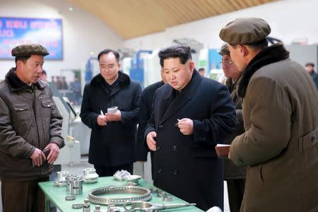 North Korean leader Kim Jong Un (2nd R) visits Taeseung machinery factory in this undated photo released by North Korea's Korean Central News Agency (KCNA) in Pyongyang on March 2, 2016. REUTERS/KCNA
