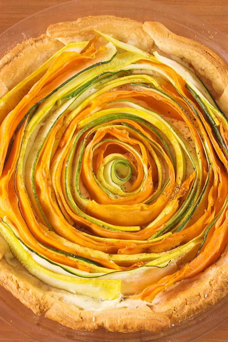 <p>This hypnotizing tart is surprisingly easy to make. Who knew veggies could be so beautiful?</p><p>Get the recipe from <a href="https://www.delish.com/cooking/recipe-ideas/recipes/a52355/bloomin-vegetable-tart-recipe/" rel="nofollow noopener" target="_blank" data-ylk="slk:Delish;elm:context_link;itc:0;sec:content-canvas" class="link ">Delish</a>.</p>