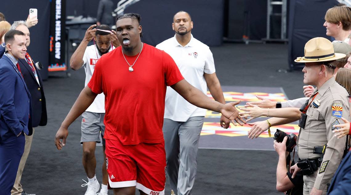 N.C. State’s DJ Burns Jr. greets fans as he walks to the court to warmup before N.C. State’s game against Purdue in the NCAA Tournament national semfinals at State Farm Stadium in Glendale, Ariz., Saturday, April 6, 2024. Ethan Hyman/ehyman@newsobserver.com