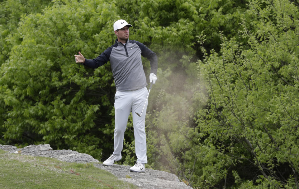 Lucas Bjerregaard reacts as he plays a shot from a ledge on the second hole during semifinal play against Matt Kuchar at the Dell Technologies Match Play Championship golf tournament, Sunday, March 31, 2019, in Austin, Texas. (AP Photo/Eric Gay)