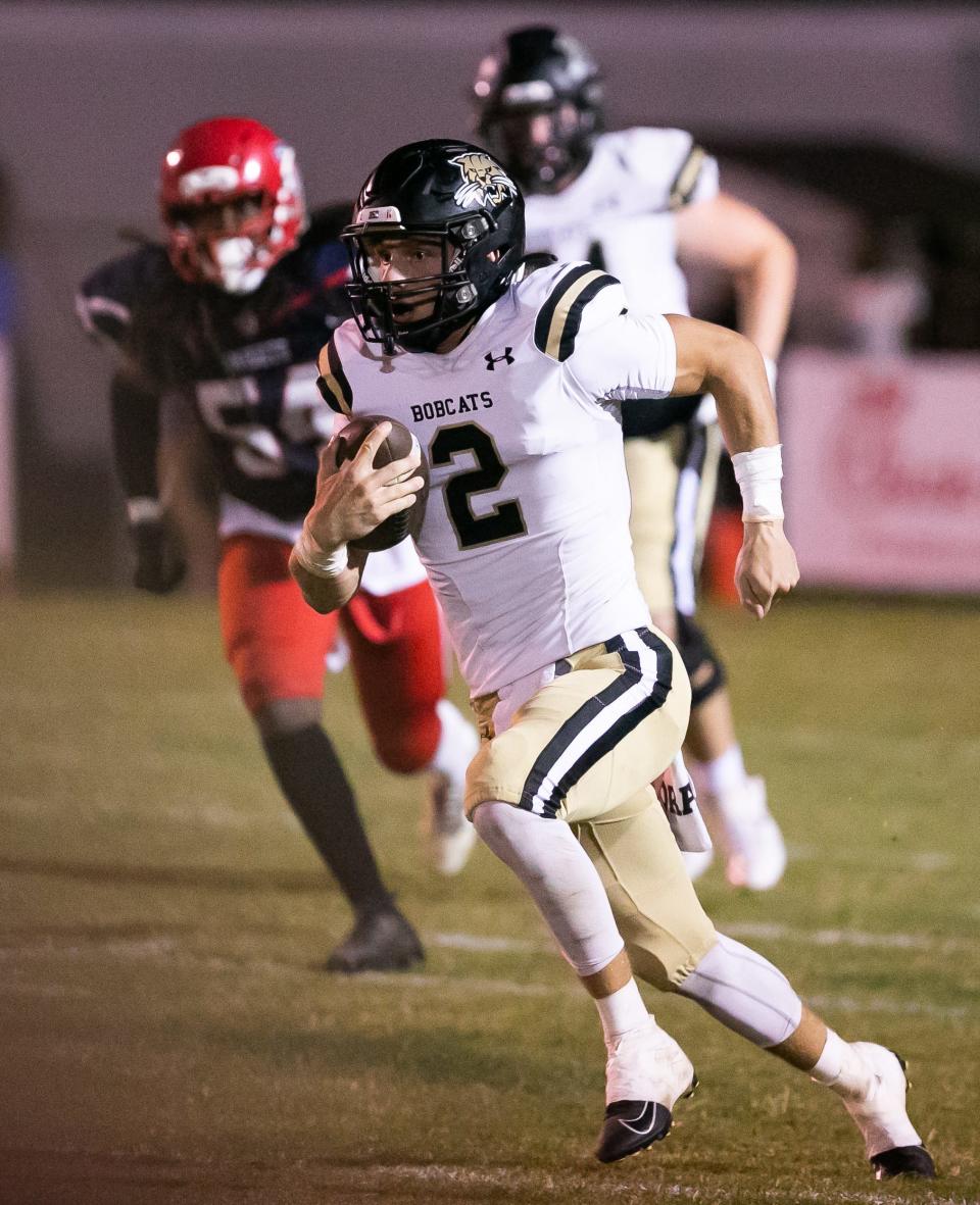 Buchholz Bobcats Creed Whittemore (2) scrambles for yards. Vanguard High School hosted Buchholz High School at Booster Stadium in Ocala, FL on Friday, September 23, 2022.  [Doug Engle/Ocala Star Banner]