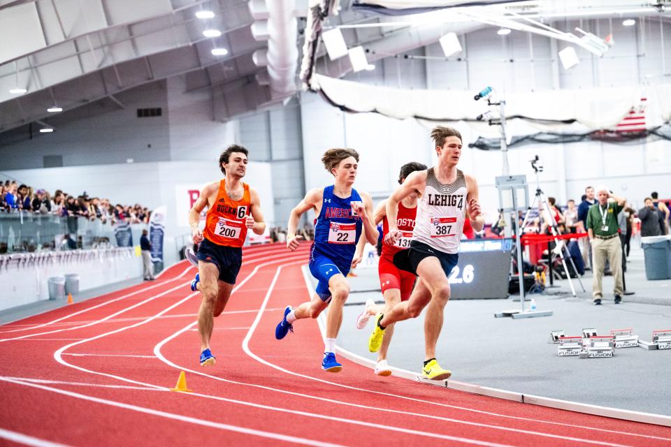 Kaden Kluth, of Portsmouth, competes in the 800 meter race at the Patriot League Track and Field Championships. Kluth, in the blue uniform, set a school record.