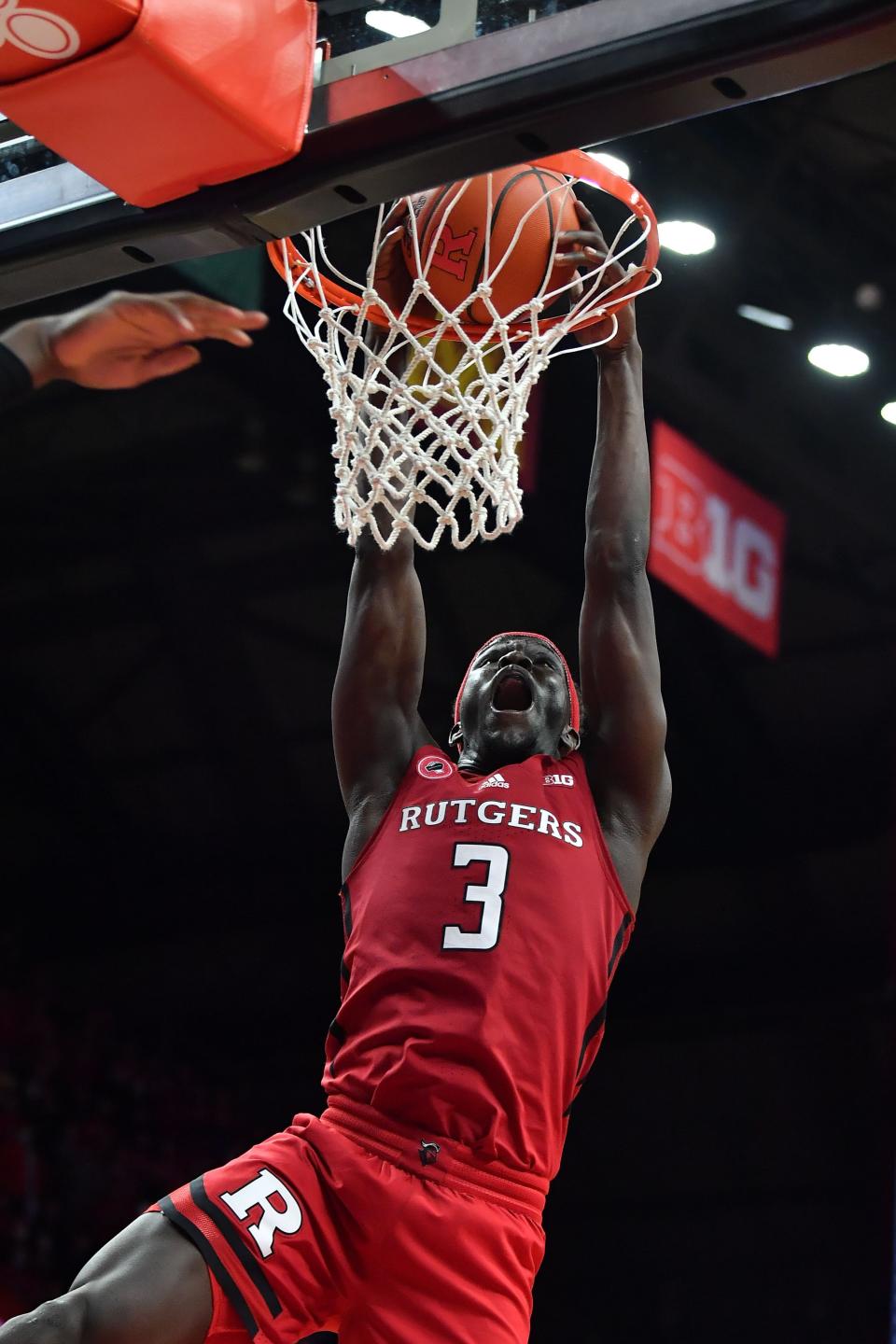 Dec 9, 2021; Piscataway, New Jersey, USA; Rutgers Scarlet Knights forward Mawot Mag (3) dunks the ball against the Purdue Boilermakers during the second half at Jersey Mike's Arena. Mandatory Credit: Catalina Fragoso-USA TODAY Sports
