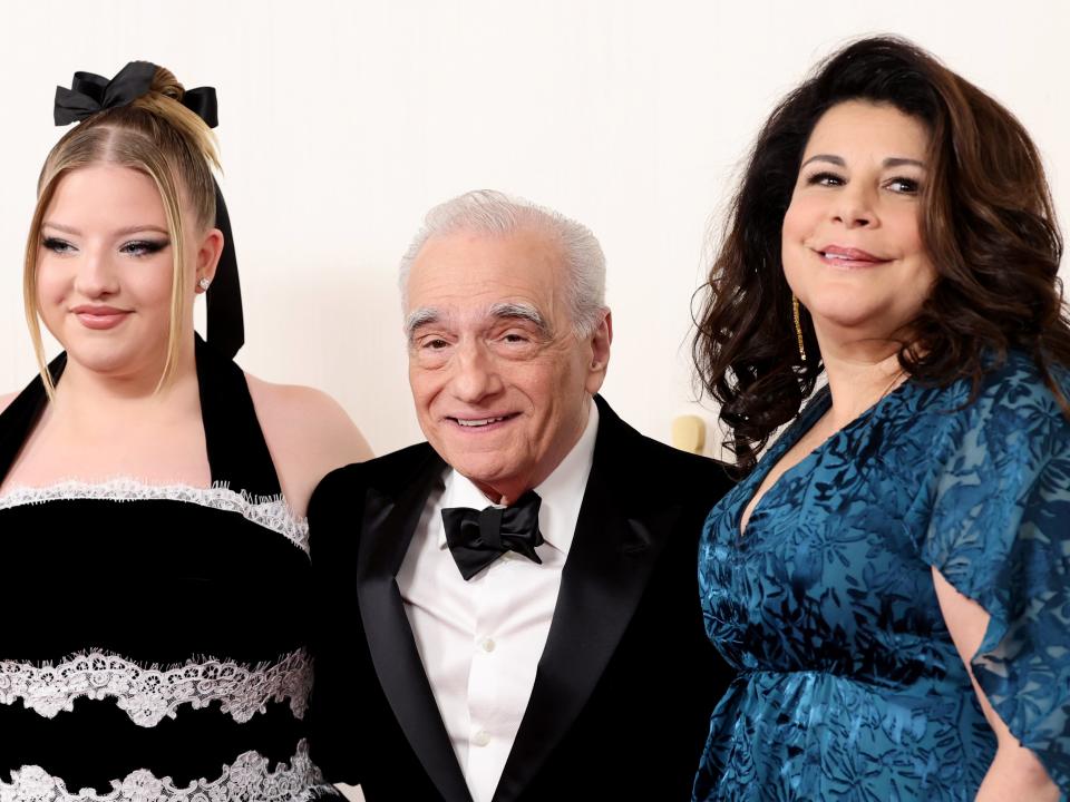 Martin Scorsese (C) poses with his daughters, Francesca (L) and Cathy (R).