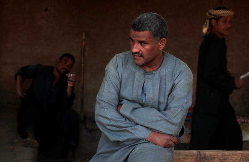 Aref Mohamed, a farmer, looks on before an interview with Reuters at his farmland in Comer village in Esna south of Luxor