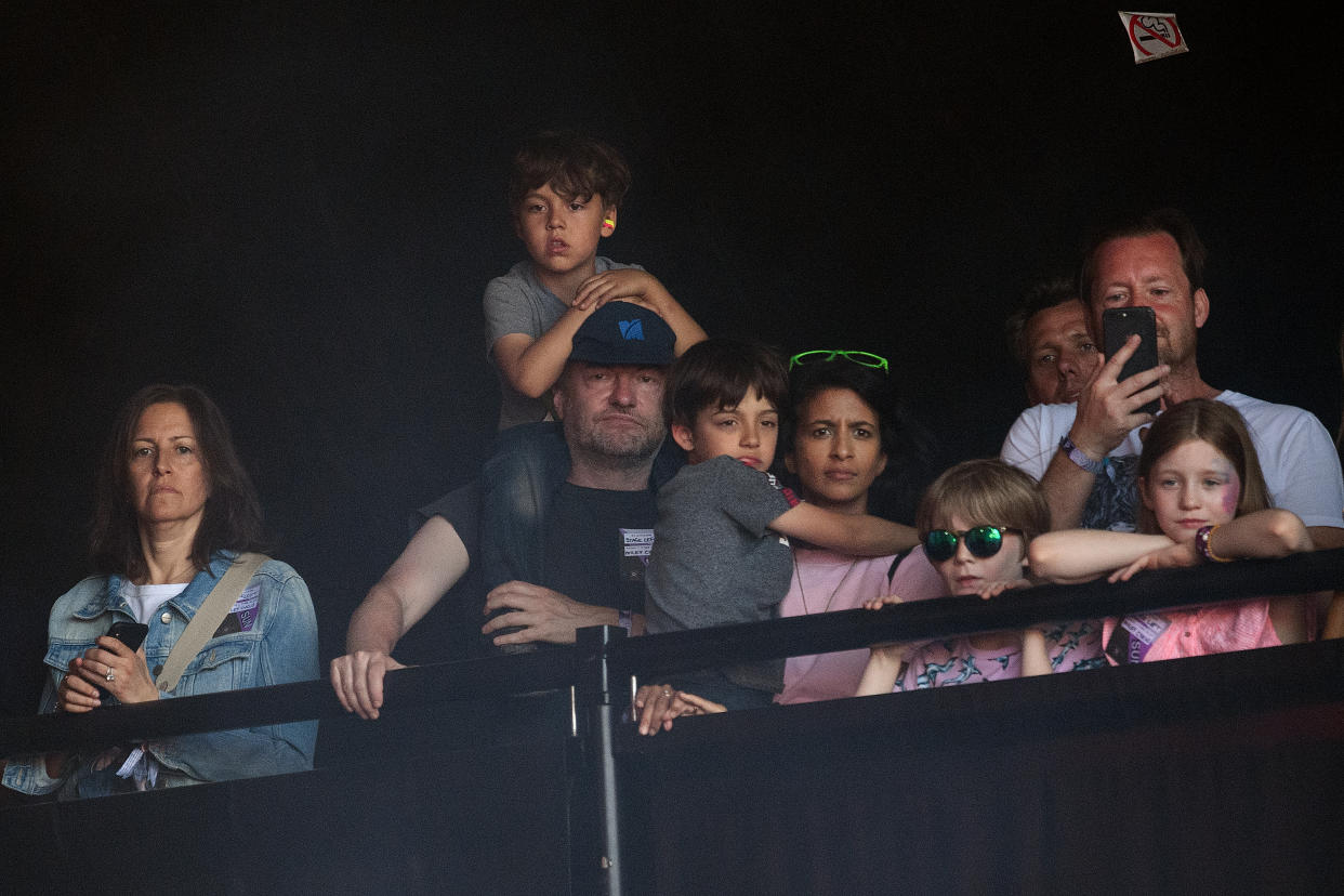 GLASTONBURY, ENGLAND - JUNE 30: Writer Charlie Brooker (2L) and his wife Konnie Huq (C) watch Miley Cyrus perform on the Pyramid Stage on day five of Glastonbury Festival at Worthy Farm, Pilton on June 30, 2019 in Glastonbury, England. Glastonbury is the largest greenfield festival in the world, and is attended by around 175,000 people.  (Photo by Leon Neal/Getty Images)