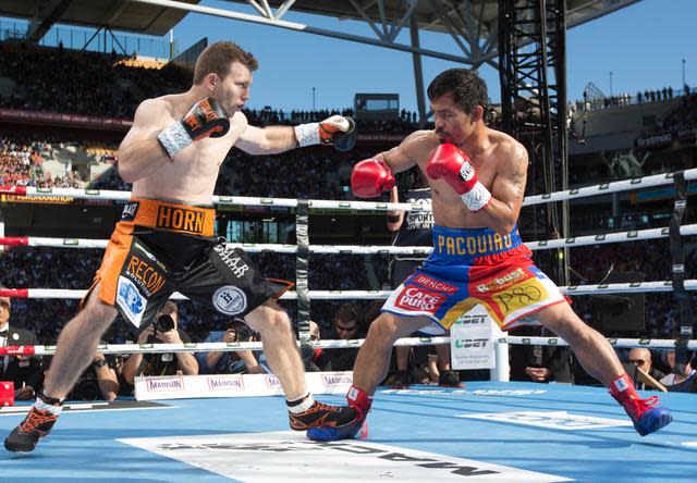 Jeff Horn and Manny Pacquiao trade blows during their fight. (Duco Promotions)