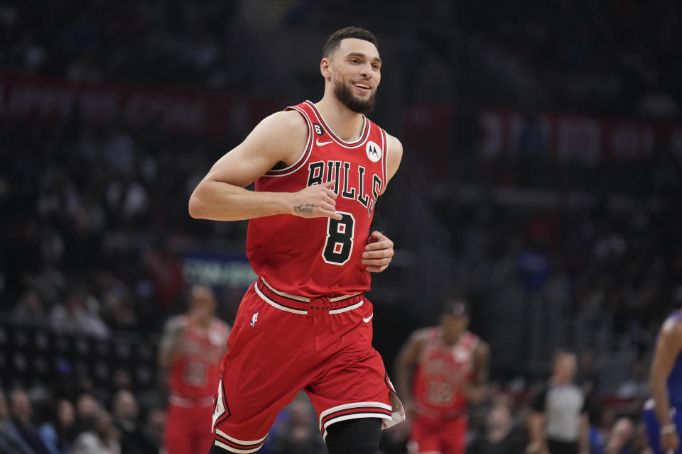 Chicago Bulls guard Zach LaVine smiles after making a 3-point basket during the first half of an NBA basketball game against the Los Angeles Clippers Monday, March 27, 2023, in Los Angeles. (AP Photo/Marcio Jose Sanchez)