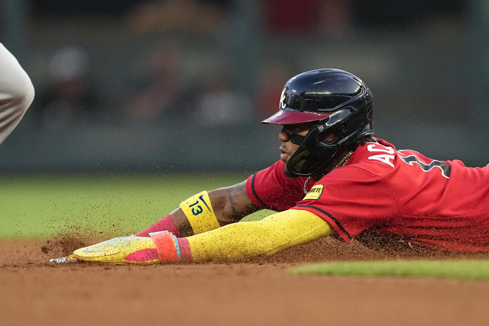 Atlanta Braves' Ronald Acuna Jr. steals second base during the fourth inning of the team's baseball game against the Miami Marlins on Friday, June 30, 2023, in Atlanta. (AP Photo/John Bazemore)