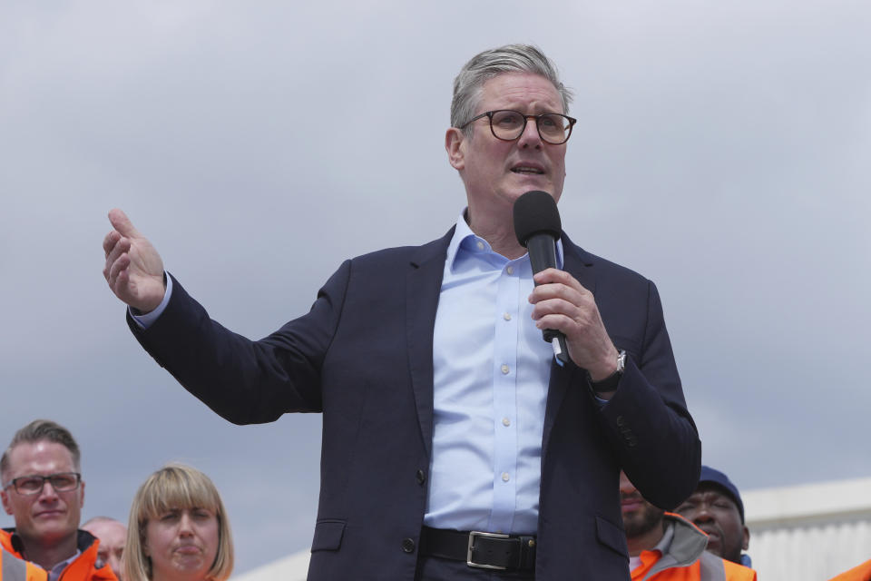 Labour Party leader Keir Starmer gestures as he speak to port workers during a general election campaign event Southampton Docks in Southampton, England, Monday, June 17, 2024. (AP Photo/Kin Cheung)