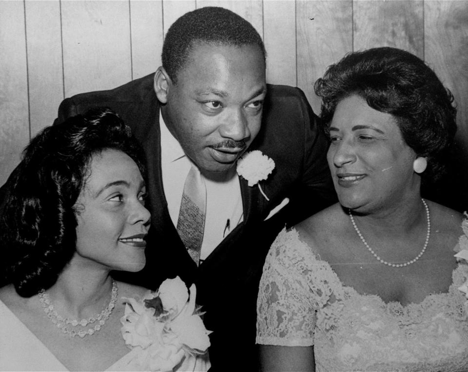 <p>Dr. Martin Luther King, Jr., president of the Southern Christian Leadership Conference, chats with his wife, Coretta, left, and civil rights champion Constance Baker Motley before the start of an S.C.L.C. banquet Aug. 9, 1965, in Birmingham, Ala. (AP Photo) </p>