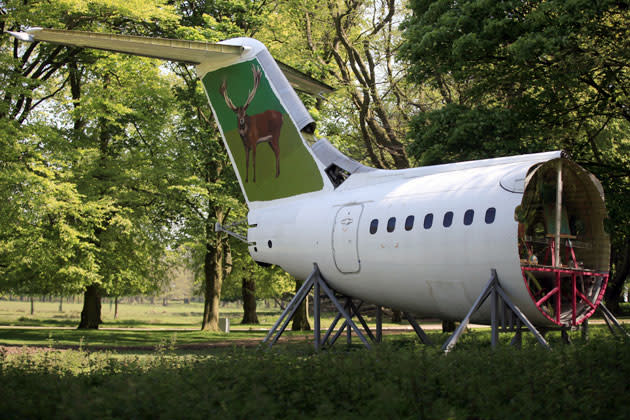 An aircraft tail section entitled 'Gleaners of the Infocalypse' by artist Jeanu Projects is displayed at Tatton Park as part of the 2012 Tatton Biennial on May 21, 2012 in Knutsford, England. This years exhibition explores 'Flights of Fancy' and displays the work of more than 20 artists at the National Trust property in Cheshire. The exhibition runs until September. (Photo by Christopher Furlong/Getty Images)