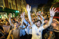 <p>Fans packed into bars, streets and outdoor cinemas to watch the game on Tuesday night. (Picture: Getty) </p>