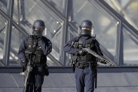 French police secure the site near the Louvre Pyramid in Paris, France, February 3, 2017 after a French soldier shot and wounded a man armed with a knife after he tried to enter the Louvre museum in central Paris carrying a suitcase, police sources said. REUTERS/Christian Hartmann