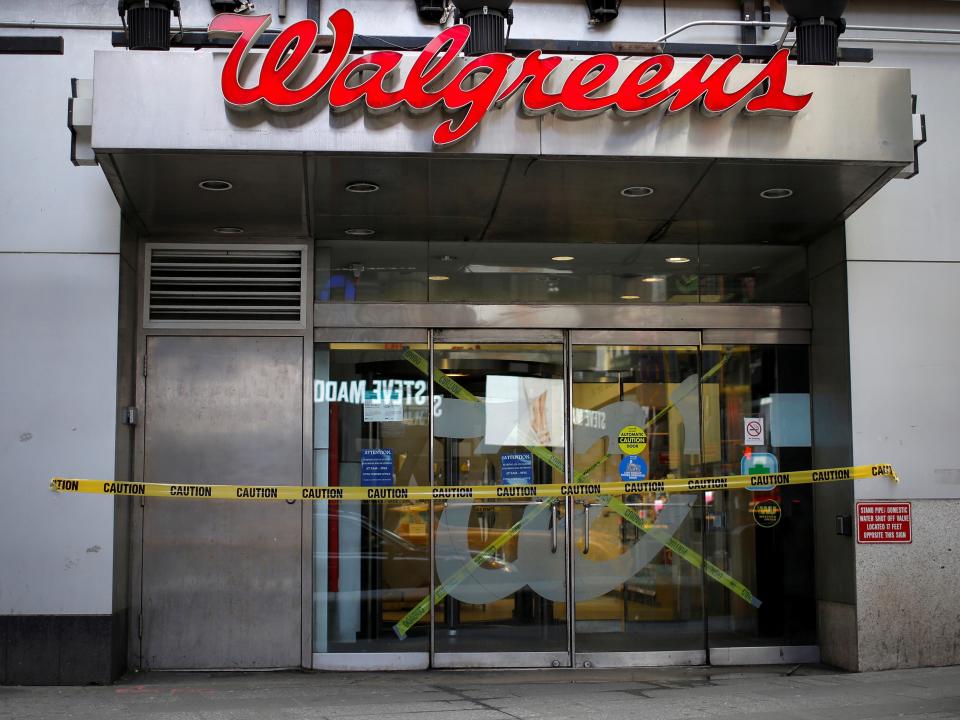 FILE PHOTO: A shuttered Walgreens pharmacy store is seen during the coronavirus outbreak in Times Square in Manhattan in New York City, New York, U.S., March 20, 2020. REUTERS/Mike Segar/File Photo