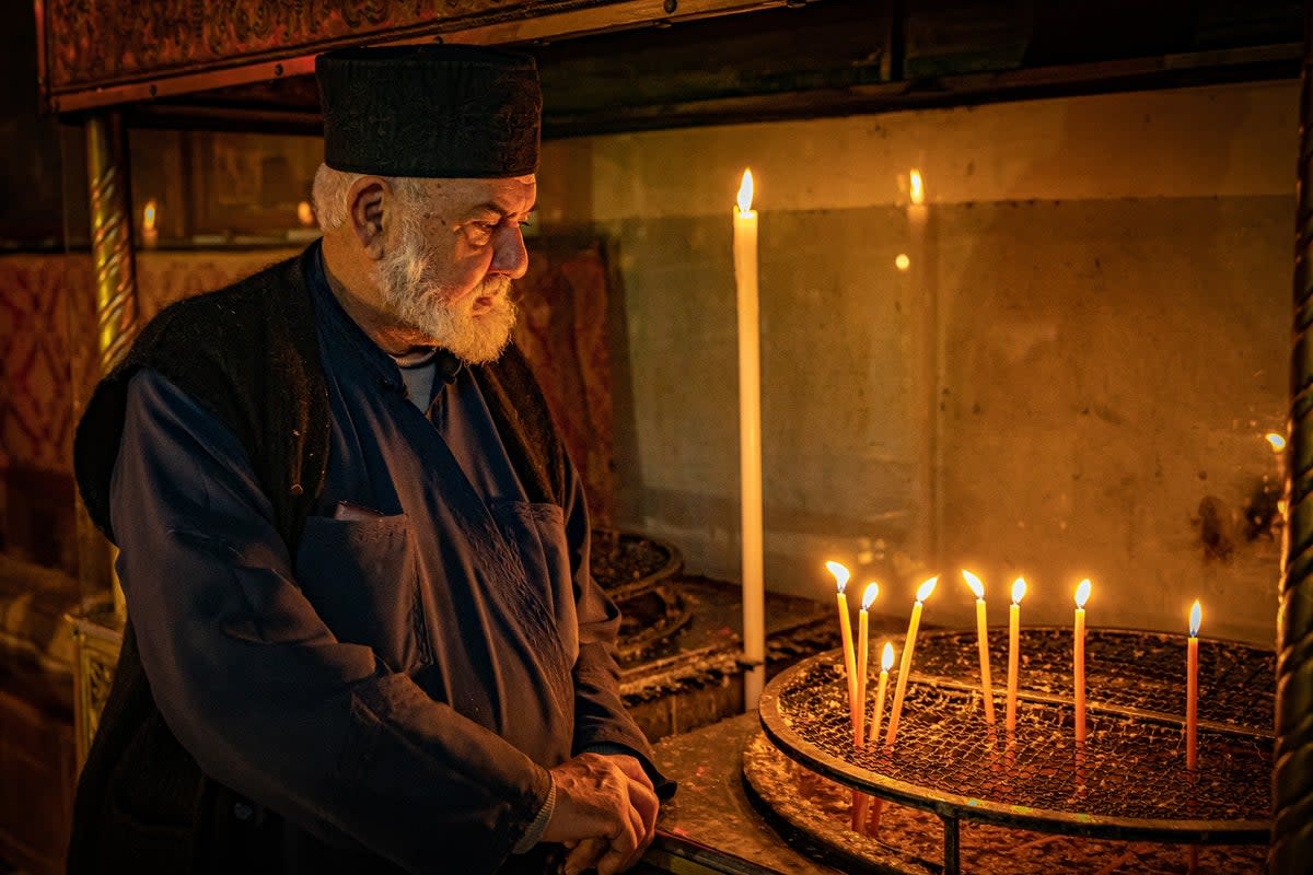 Greek Orthodox priest Father Spiridon at the virtually empty Church of the Nativity in Bethlehem (Bel Trew/The Independent)