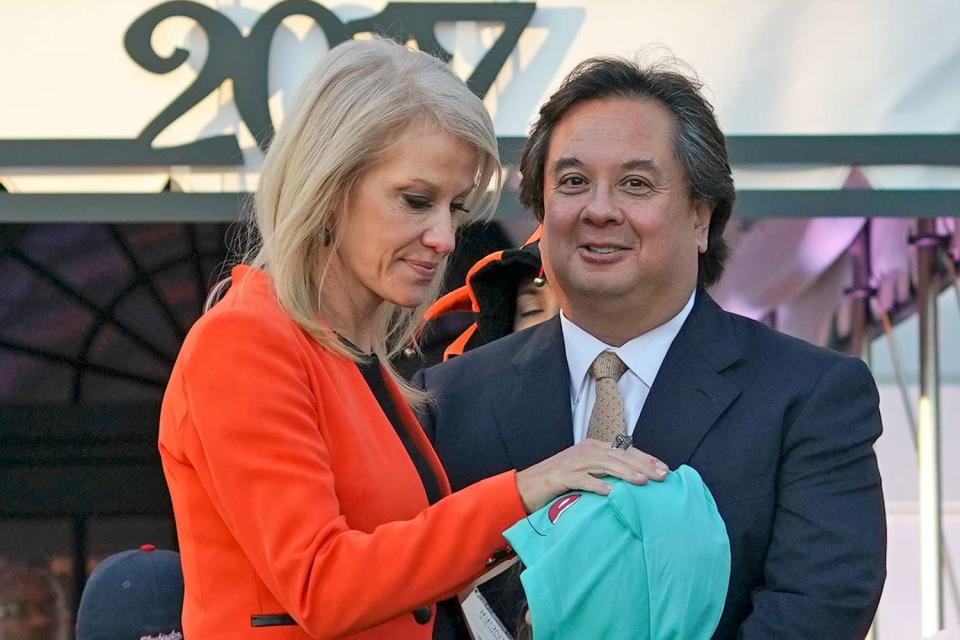 Counselor to the President Kellyanne Conway, center, and her husband George Conway, right, greet guests on the South Lawn of the White House in Washington during a Halloween event welcoming children from the Washington area and children of military families to trick-or-treat, Monday, Oct. 30, 2017.