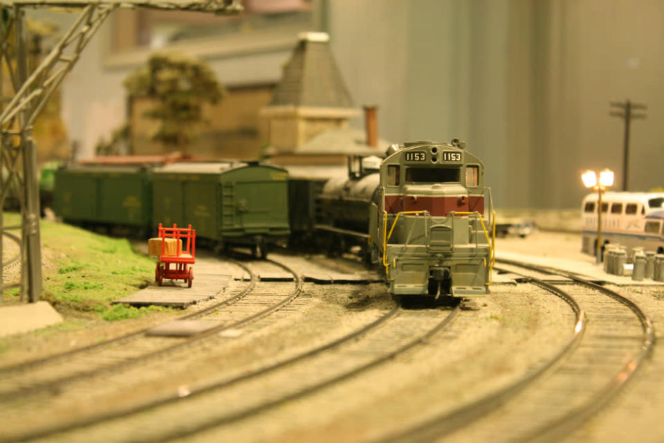 A model train speeds around a corner. After 67 years in the Liberty Village location, The Model Railroad Club of Toronto will be moving to make way for a condo.
