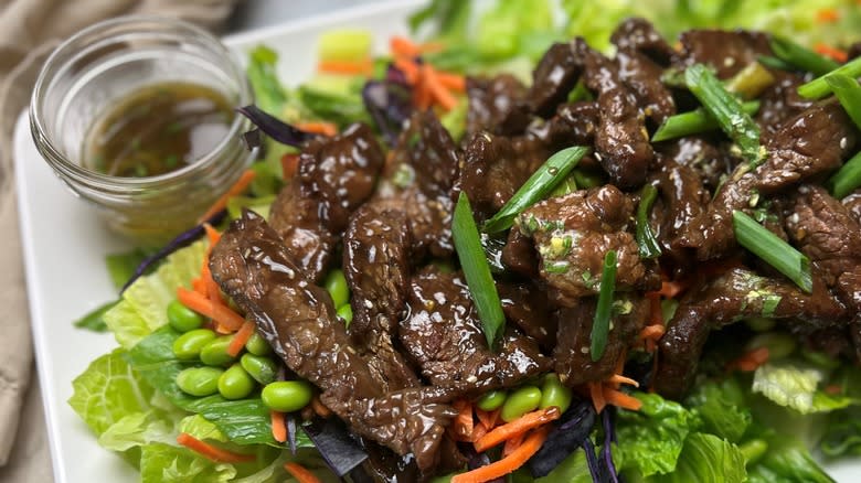 beef salad on white plate