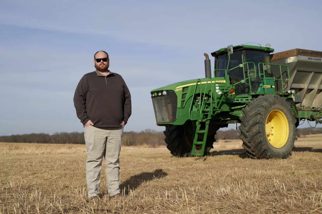 Jared Wilson with his John Deere tractor. (Kenny Johnson for NBC News)