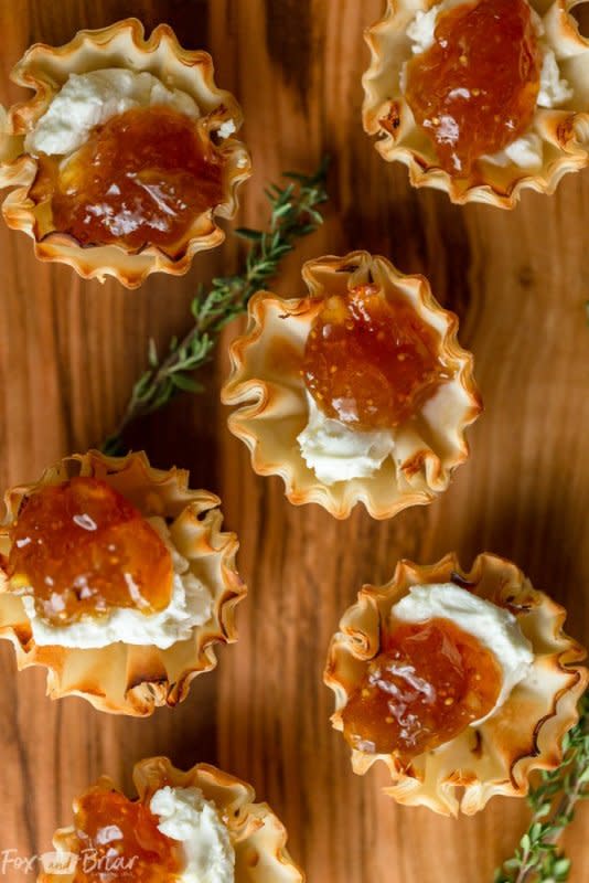 <p>Fox and Briar</p><p>These easy, three ingredient fig and goat cheese bites are quick and easy and taste amazing!</p><p><strong>Get the recipe: <a href="https://www.foxandbriar.com/fig-and-goat-cheese-bites-in-phyllo-cups/" rel="nofollow noopener" target="_blank" data-ylk="slk:Fig and Goat Cheese Bites in Phyllo Cups;elm:context_link;itc:0;sec:content-canvas" class="link rapid-noclick-resp"><em>Fig and Goat Cheese Bites in Phyllo Cups</em></a></strong></p>